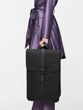 Rains Waterproof Laptop Backpack with a small T Brand (NYT) logo UNISEX